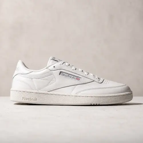 Reebok Club C 85 style white tennis shoes for men shown as clean casual sneakers for chinos, jeans, and everyday outfits
